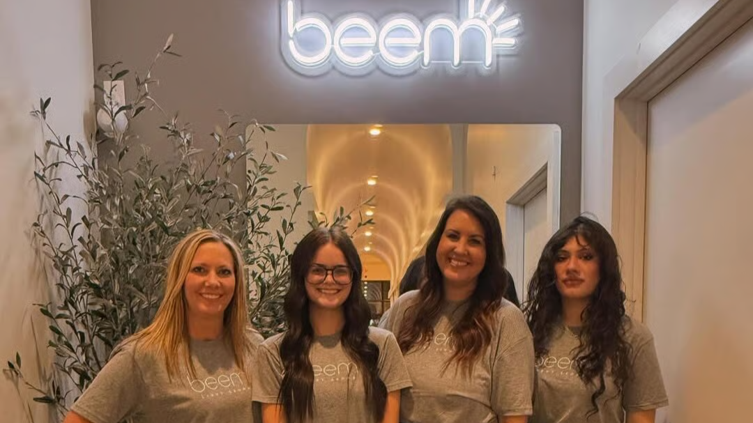 Beem Woodbury staff members pose for group picture in the studio.
