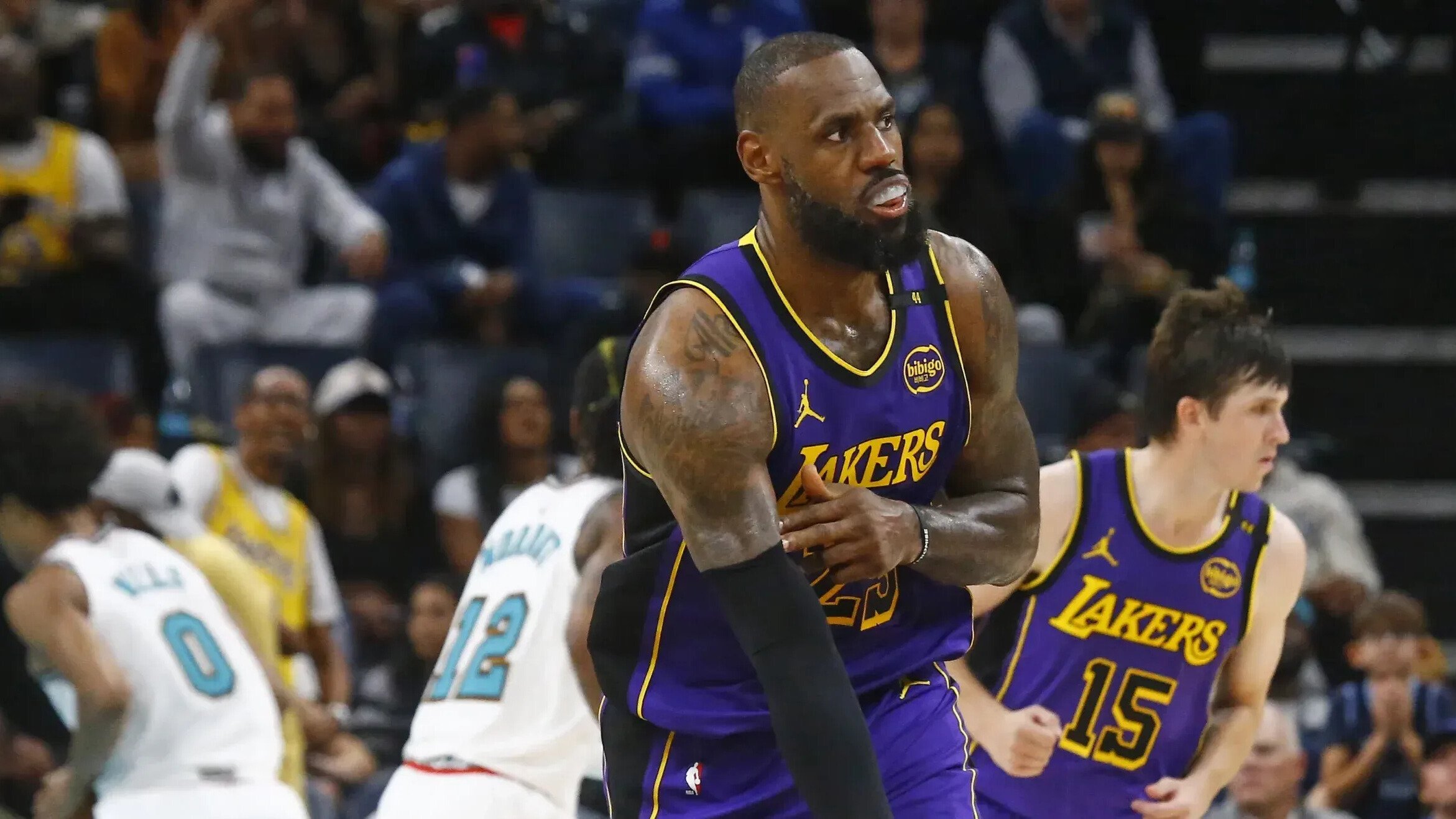 Lebron James celebrates basketball shot.